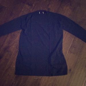 . ° black knit cardigan sweater.